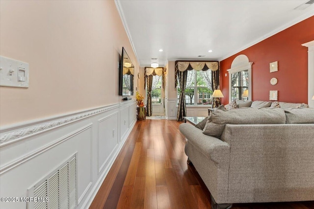2420 Canterbury Ln, North Brunswick, NJ 08902 - living room with wood-type flooring, ornamental molding, wainscoting, a decorative wall, and recessed lighting