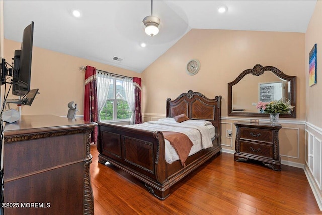 2420 Canterbury Ln, North Brunswick, NJ 08902 - bedroom featuring vaulted ceiling, wainscoting, wood finished floors, a decorative wall, and an office area