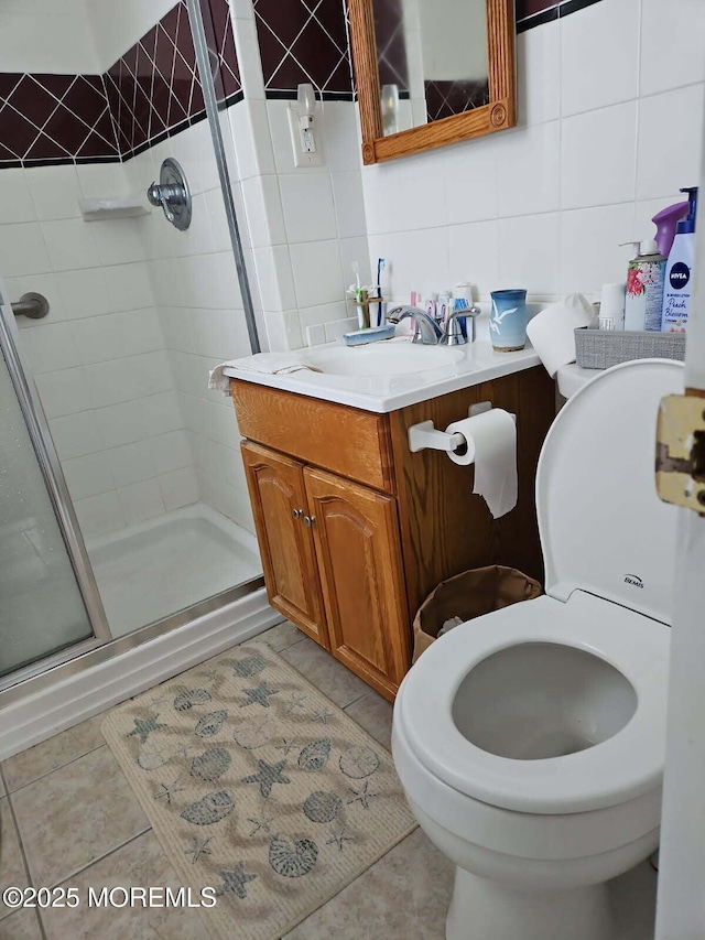 27 Maracaibo Pl, Toms River, NJ 08757 - bathroom with tile walls, a stall shower, vanity, tile patterned flooring, and tasteful backsplash