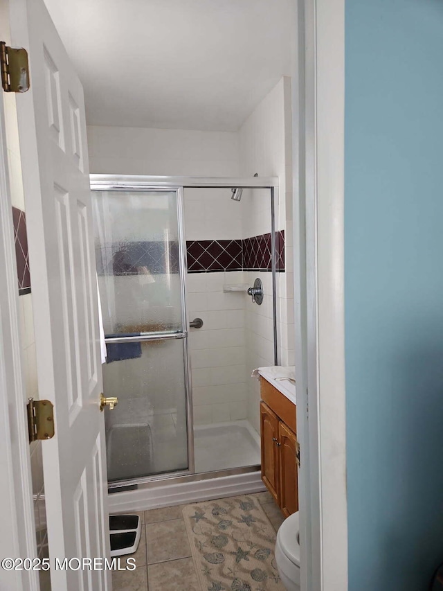 27 Maracaibo Pl, Toms River, NJ 08757 - bathroom with vanity, tile patterned flooring, and a shower stall