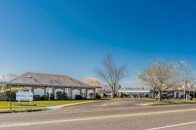 27 Maracaibo Pl, Toms River, NJ 08757 - view of asphalt street with sidewalks and curbs