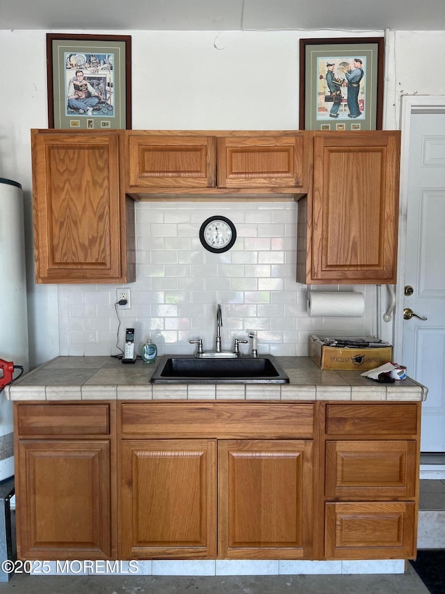 27 Maracaibo Pl, Toms River, NJ 08757 - kitchen with tasteful backsplash, tile countertops, and brown cabinetry