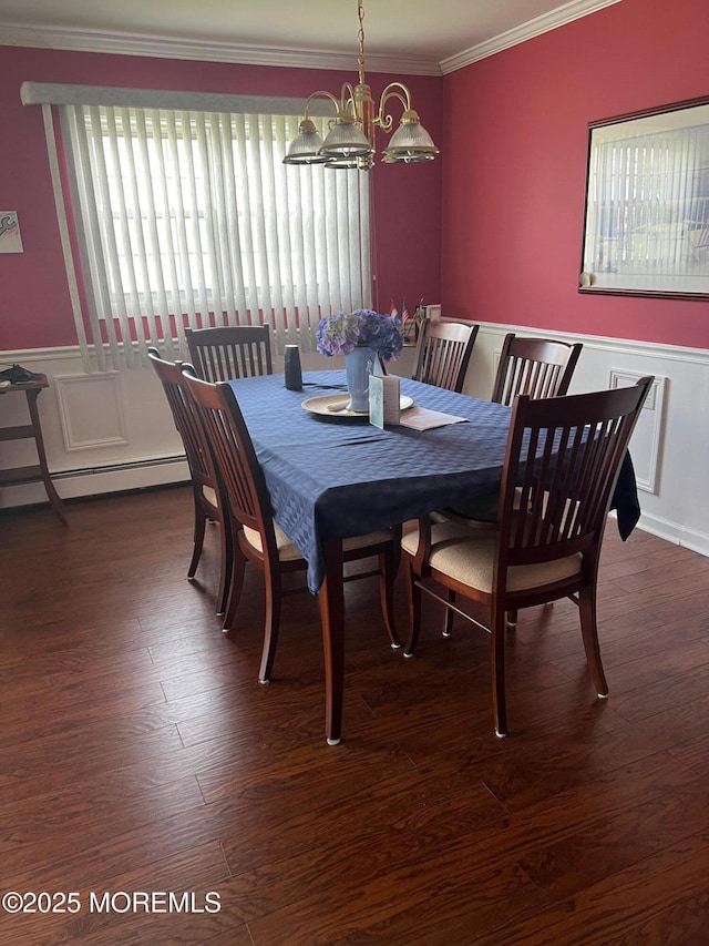 27 Maracaibo Pl, Toms River, NJ 08757 - dining room featuring a baseboard radiator, crown molding, a chandelier, a wainscoted wall, and wood finished floors