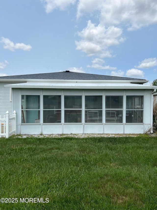 27 Maracaibo Pl, Toms River, NJ 08757 - view of property exterior with a yard and a sunroom