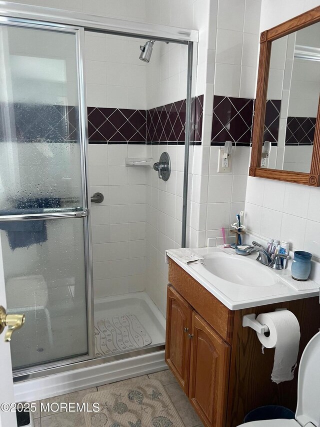 27 Maracaibo Pl, Toms River, NJ 08757 - full bathroom featuring a stall shower, vanity, decorative backsplash, and tile patterned floors