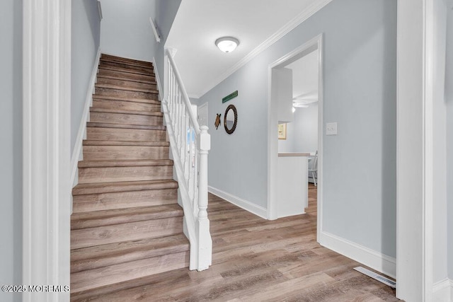 3 Drake Dr, Bayville, NJ 08721 - stairs featuring crown molding, wood finished floors, and baseboards