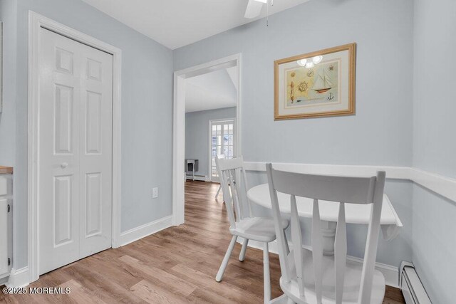 3 Drake Dr, Bayville, NJ 08721 - dining area with a baseboard radiator, light wood-style flooring, baseboards, and a ceiling fan