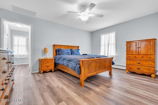 3 Drake Dr, Bayville, NJ 08721 - bedroom featuring multiple windows, light wood-style floors, a baseboard radiator, and baseboards
