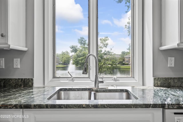 117 Sequoia Woods Ct, Holmdel, NJ 07733 - kitchen featuring a sink, white cabinetry, dark stone counters, and plenty of natural light