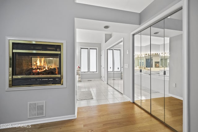 117 Sequoia Woods Ct, Holmdel, NJ 07733 - corridor with baseboards and wood finished floors