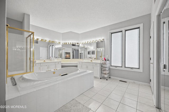 117 Sequoia Woods Ct, Holmdel, NJ 07733 - full bathroom featuring a stall shower, a bath, two vanities, tile patterned floors, and a textured ceiling