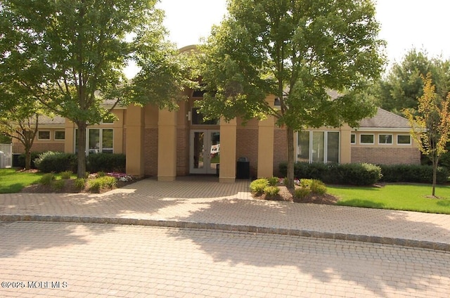 117 Sequoia Woods Ct, Holmdel, NJ 07733 - obstructed view of property with french doors and brick siding