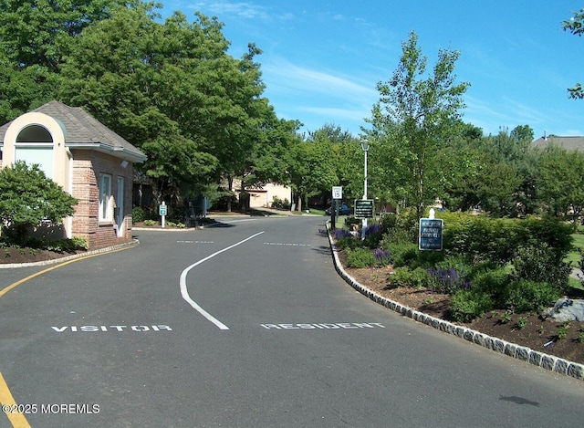 117 Sequoia Woods Ct, Holmdel, NJ 07733 - view of asphalt street with street lighting and curbs