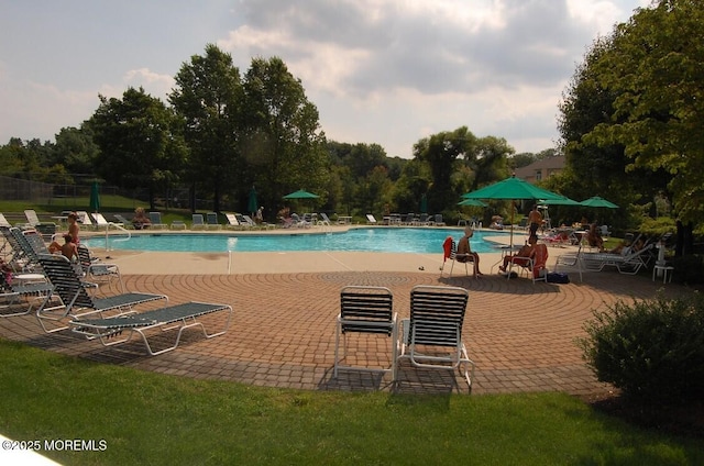 117 Sequoia Woods Ct, Holmdel, NJ 07733 - community pool featuring a patio area and view of wooded area