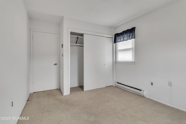 15 Courtshire Dr, Brick, NJ 08723 - unfurnished bedroom featuring a baseboard radiator, light colored carpet, and a closet