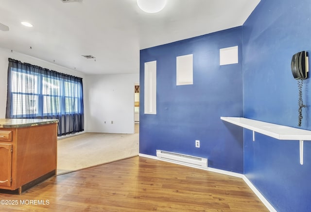 15 Courtshire Dr, Brick, NJ 08723 - unfurnished dining area with baseboard heating, wood finished floors, and baseboards