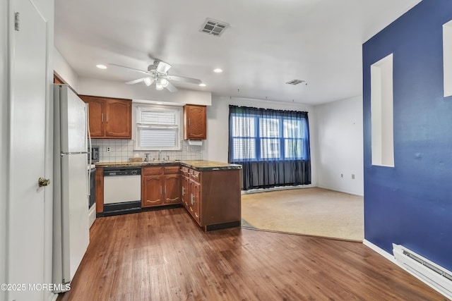 15 Courtshire Dr, Brick, NJ 08723 - kitchen with white appliances, a baseboard radiator, a sink, dark wood finished floors, and ceiling fan