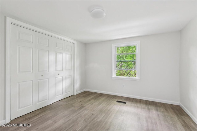 46 Roberts Rd, Toms River, NJ 08755 - unfurnished bedroom with wood finished floors, baseboards, and a closet
