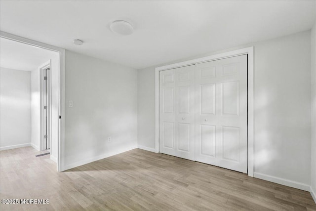 46 Roberts Rd, Toms River, NJ 08755 - unfurnished bedroom with light wood-type flooring, baseboards, and a closet