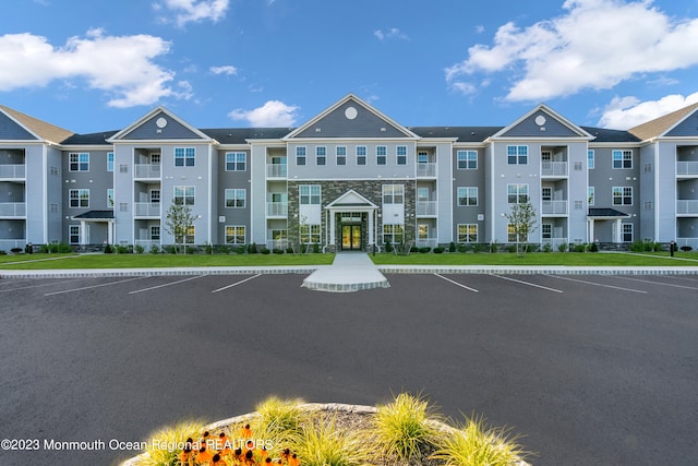 750 Lighthouse Dr Unit 3101, Barnegat, NJ 08005 - view of building exterior with uncovered parking