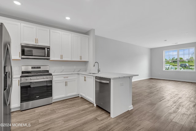 750 Lighthouse Dr Unit 3101, Barnegat, NJ 08005 - kitchen with appliances with stainless steel finishes, a peninsula, light wood-style floors, white cabinets, and recessed lighting
