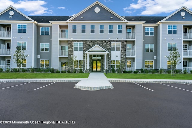 750 Lighthouse Dr Unit 1112, Barnegat, NJ 08005 - view of building exterior with uncovered parking
