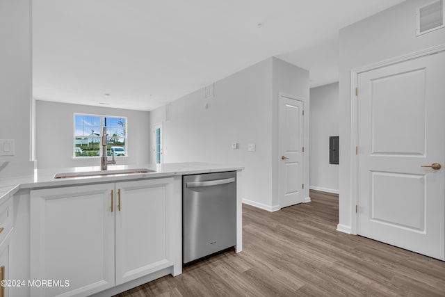 750 Lighthouse Dr Unit 1112, Barnegat, NJ 08005 - kitchen featuring dishwasher, a sink, white cabinets, light wood-type flooring, and baseboards
