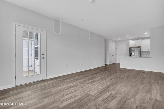 750 Lighthouse Dr Unit 1112, Barnegat, NJ 08005 - unfurnished living room with wood finished floors, recessed lighting, and baseboards
