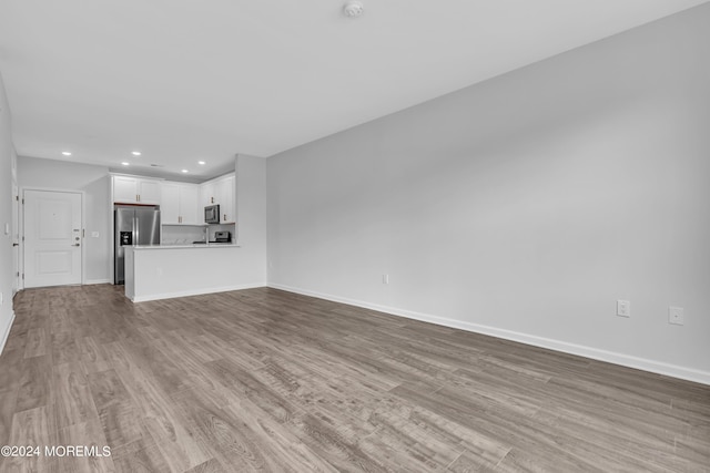 750 Lighthouse Dr Unit 1112, Barnegat, NJ 08005 - unfurnished living room featuring recessed lighting, wood finished floors, and baseboards