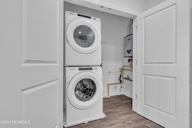 750 Lighthouse Dr Unit 1112, Barnegat, NJ 08005 - laundry area with estacked washer and dryer and wood finished floors