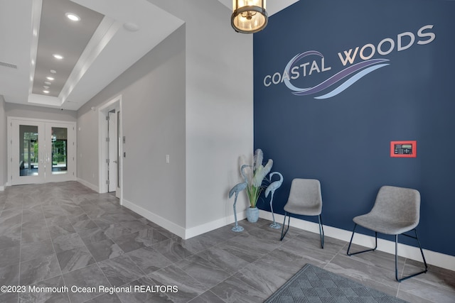 750 Lighthouse Dr Unit 1112, Barnegat, NJ 08005 - corridor featuring recessed lighting, baseboards, french doors, and a tray ceiling