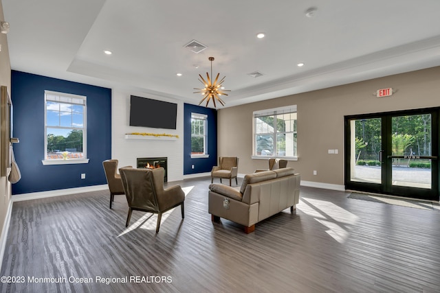 750 Lighthouse Dr Unit 1112, Barnegat, NJ 08005 - living area featuring a tray ceiling, baseboards, a glass covered fireplace, wood finished floors, and recessed lighting