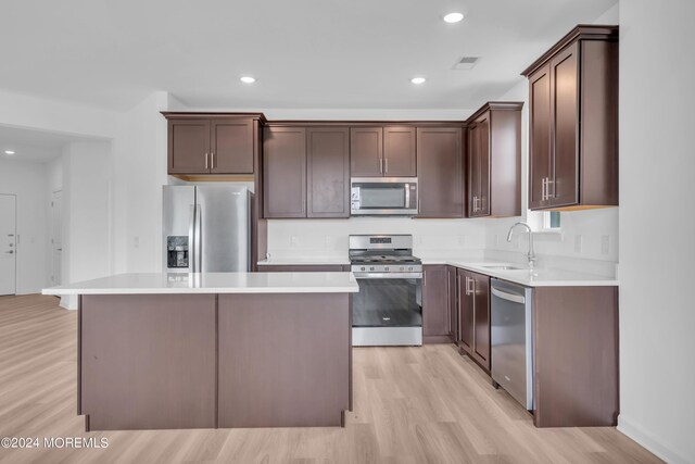 750 Lighthouse Dr Unit 1103, Barnegat, NJ 08005 - kitchen featuring stainless steel appliances, light wood-style flooring, a sink, a kitchen island, and recessed lighting