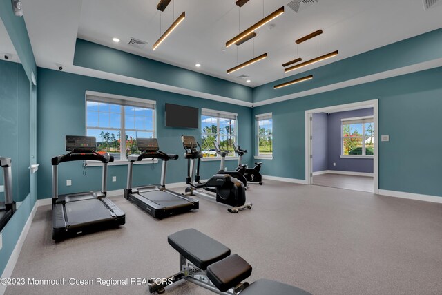 750 Lighthouse Dr Unit 1103, Barnegat, NJ 08005 - gym featuring baseboards, recessed lighting, and a tray ceiling