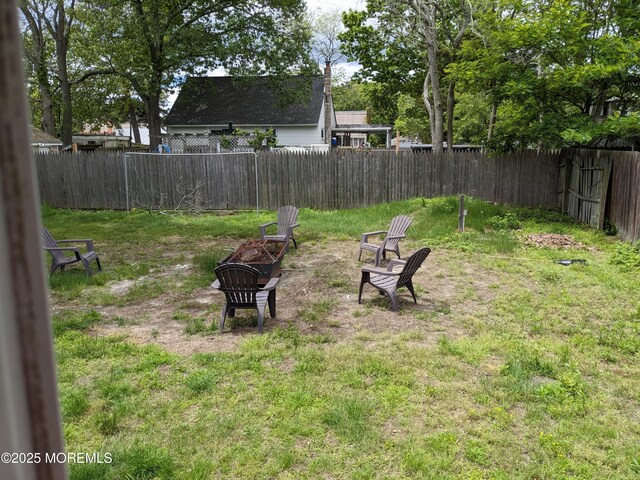6 Hoover Dr, Brick, NJ 08724 - view of yard with an outdoor fire pit