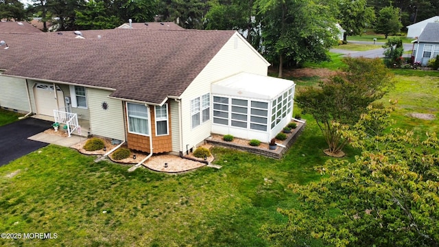 14 Ardsley Ave Unit 64, Whiting, NJ 08759 - back of house with a sunroom, roof with shingles, driveway, and a yard
