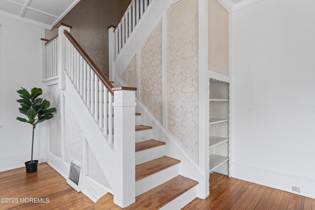 42 Chestnut St, Red Bank, NJ 07701 - stairs featuring hardwood / wood-style floors, baseboards, and crown molding
