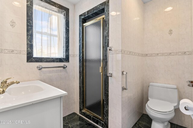 42 Chestnut St, Red Bank, NJ 07701 - full bathroom with tile walls, a stall shower, toilet, and vanity