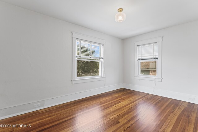 42 Chestnut St, Red Bank, NJ 07701 - empty room featuring wood-type flooring and baseboards