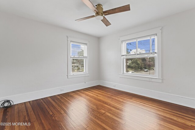 42 Chestnut St, Red Bank, NJ 07701 - spare room featuring baseboards, hardwood / wood-style floors, and a ceiling fan