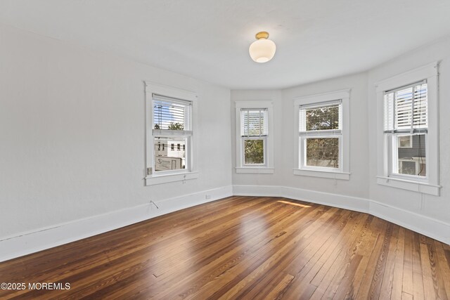 42 Chestnut St, Red Bank, NJ 07701 - spare room featuring wood-type flooring and baseboards