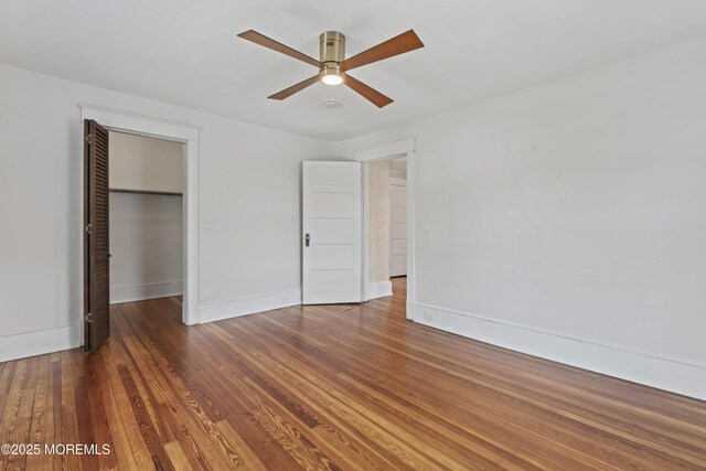 42 Chestnut St, Red Bank, NJ 07701 - unfurnished bedroom with baseboards, hardwood / wood-style flooring, a closet, and a ceiling fan