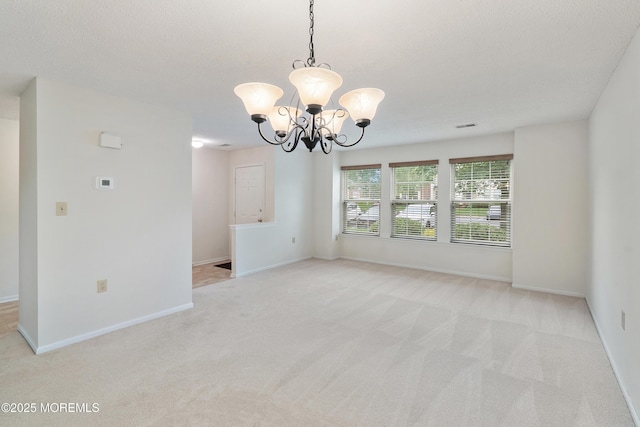 29 Copley Ct Unit 6, Freehold, NJ 07728 - empty room featuring light colored carpet, a chandelier, and baseboards