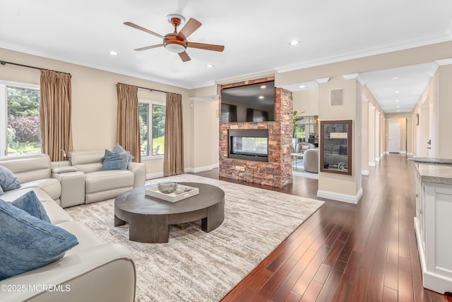 806 Turquoise Trl, Morganville, NJ 07751 - living room with ceiling fan, a fireplace, ornamental molding, dark wood-style floors, and recessed lighting