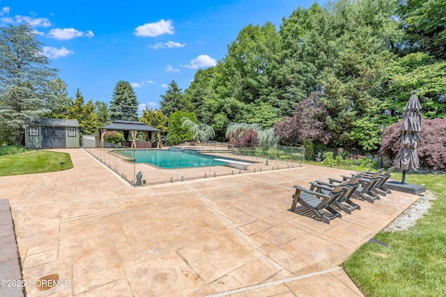806 Turquoise Trl, Morganville, NJ 07751 - outdoor pool with a gazebo, a patio area, an outbuilding, and view of scattered trees