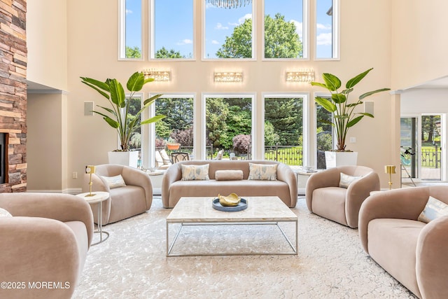 806 Turquoise Trl, Morganville, NJ 07751 - living area with a high ceiling, plenty of natural light, and a stone fireplace