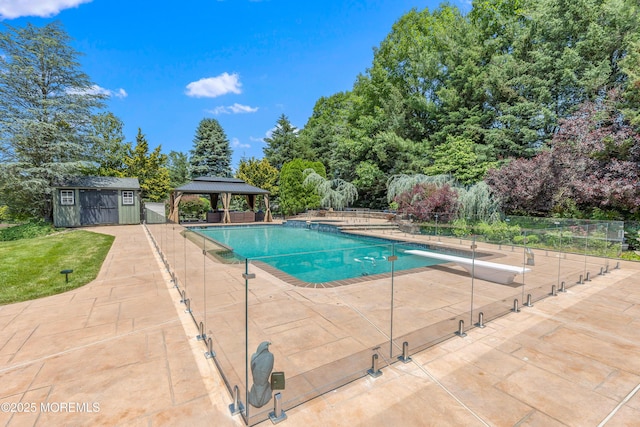 806 Turquoise Trl, Morganville, NJ 07751 - outdoor pool with a patio, a gazebo, a diving board, a shed, and view of scattered trees