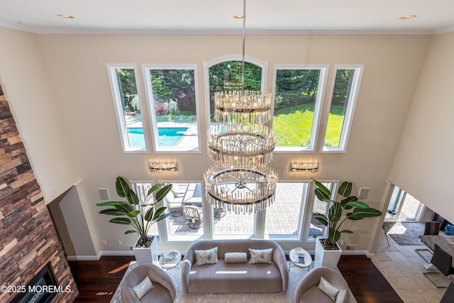 806 Turquoise Trl, Morganville, NJ 07751 - living area featuring a chandelier, wood finished floors, and crown molding