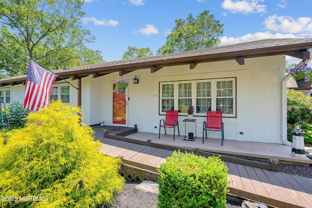512 Highland Ter, Brick, NJ 08723 - view of front of house with stucco siding and a porch
