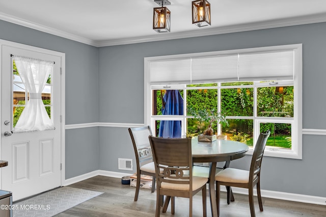 512 Highland Ter, Brick, NJ 08723 - dining area featuring baseboards, wood finished floors, and crown molding